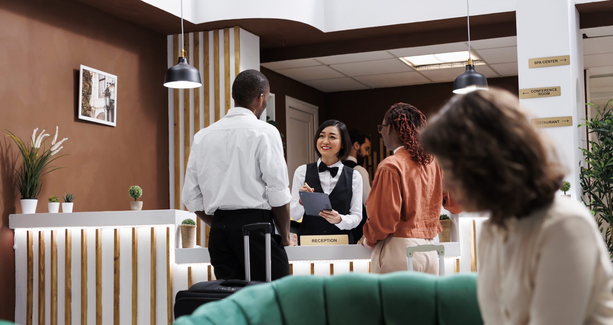 hotel-staff-registering-people-resort-filling-records-reception-desk-lobby-asian-woman-receptionist-giving-assistance-guests-with-registration-forms-give-access-key-card.jpg